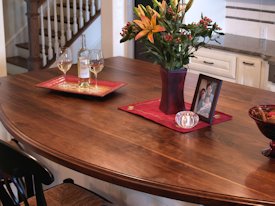 Walnut face grain wood island countertop.