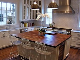 Walnut edge grain wood island countertop.