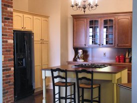 Walnut face grain wood island countertop.