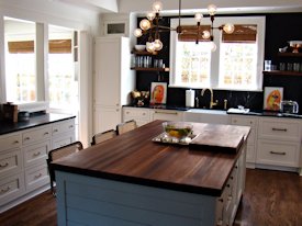 Walnut edge grain wood island countertop.