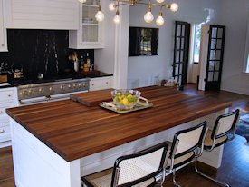 Walnut edge grain wood island countertop.