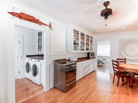 Walnut face grain wood countertops and backsplash.