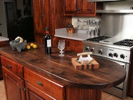 Walnut face grain wood island countertop.