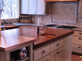 Walnut edge grain wood island countertop.