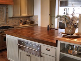 Walnut edge grain wood island countertop.