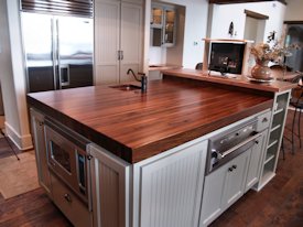 Walnut edge grain wood island countertop.