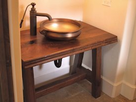 Walnut face grain reproduction wood vanity top and base.