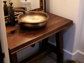 Walnut face grain reproduction wood vanity top and base.