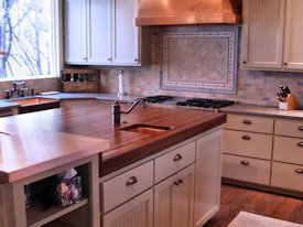 Walnut edge grain wood island countertop.