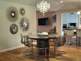 Custom Pecan Button Slab table with an organic shaped base using stacked walut rings.  Tung-Oil finish