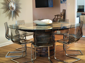 Custom Pecan Button Slab table with an organic shaped base using stacked walut rings.  Tung-Oil finish