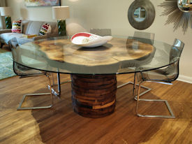 Custom Pecan Button Slab table with an organic shaped base using stacked walut rings.  Tung-Oil finish