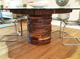 Custom Pecan Button Slab table with an organic shaped base using stacked walut rings.  Tung-Oil finish