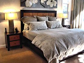 Custom Wenge and Cherry panel bed with matching night stands.