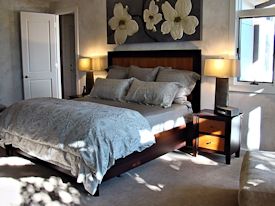 Custom Wenge and Cherry panel bed with matching night stands.