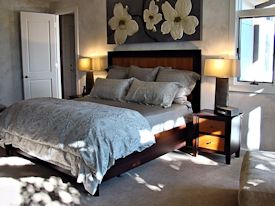 Custom Wenge and Cherry panel bed with matching night stands.