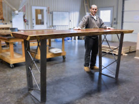 Custom bar table using a Guanacaste Slab Top with Natural Edges and a Waterlox Satin finish.  Custom polished cold rolled steel table base with clear lacquer finish.