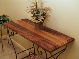 Custom hall table using a face grain iroko top and a flea-market metal base. 