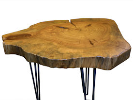 Custom Pecan Button Slab Table with Waterlox Satin Finish and metal base.