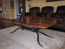 Custom coffee table using Texas Pecan with Bread Board Ends and a custom metal base. 