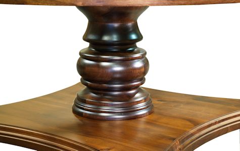 Custom round walnut table with turned pedestal-style base