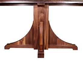 Custom distressed walnut table with pedestal-style base