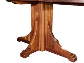 Custom distressed walnut table with pedestal-style base