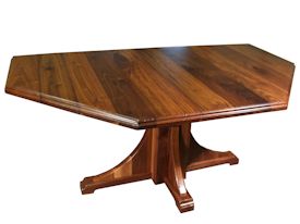 Custom distressed walnut table with pedestal-style base