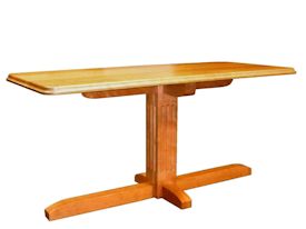 Custom cherry table with fluted pedestal-style base