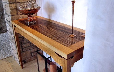 Custom hall table with a Texas Pecan framed Zebrawood floating top.