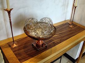 Custom hall table with a Texas Pecan framed Zebrawood floating top.