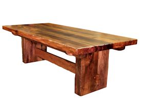 Custom face grain argentinean mesquite dining table.  Rustic trestle-style construction with through mortise and tenon jointery and hand carved edges.