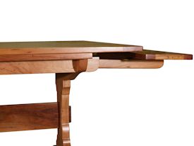 Custom trestle style dining table with self-storing leaves.  Made from spalted pecan with bread board ends and mortise and tenon jointery.