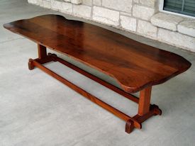 Custom mesquite coffee table with mahogany trestle style base.   