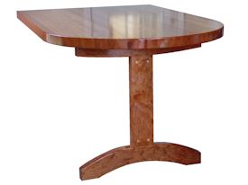 Custom cherry trestle style penninsula table with hard maple accents.