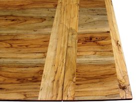 Custom spalted pecan trestle-style table with self storing leaves.  Face grain construction with bread board ends.