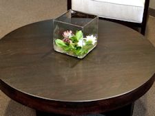 White Oak with a custom dye formula to provide a wenge look.  Face grain construction with drop edges and Waterlox Satin finish.