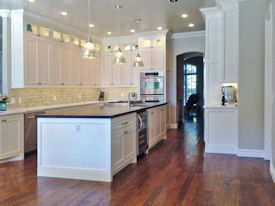 Alder face grain island countertop Custom Distressing, Dark Walnut Stain and a Waterlox Satin Finish.