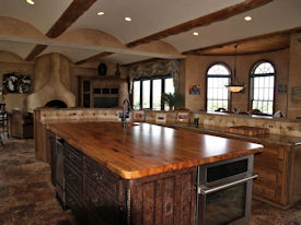 Spalted Pecan book matched slab wood island top with Natural Edges and an integrated Spalted Pecan Sink.  Waterlox Satin finish.