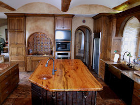 Spalted Pecan book matched slab wood island top with Natural Edges and an integrated Spalted Pecan Sink.  Waterlox Satin finish.