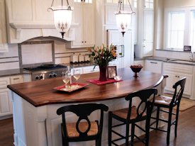 Walnut face grain wood island countertop.