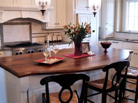 Walnut face grain wood island countertop.