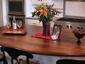 Walnut face grain wood island countertop.