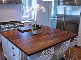 Walnut edge grain wood island countertop.