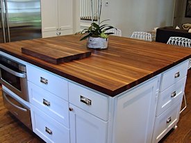 Walnut edge grain wood island countertop.