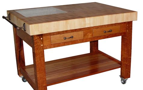 Custom Mesquite chef''s table (36x48x36) with mortise and tenon jointery and an end grain 4 inch thick Hard Maple chopping block.  Contains Pecan drawer fronts, african mahogany shelf and an 18x18 granite insert.  