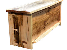 Custom Entertainment Center made from Ambrosia Maple Slabs.  Natural Edges on Face.  Mortise and Tenon Jointery.  Maple Butterfly Detailing.  Adjustable Shelves.  Cord Cutouts.  Tung Oil Citrus Finish.