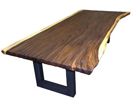 Custom dining table using a Guanacaste Slab Top with Natural Edges and Tung Oil Citrus finish.  Custom flat black metal base.