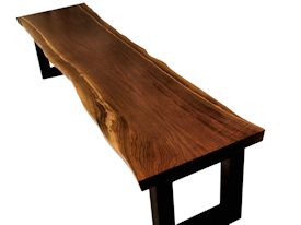 Custom bench using walnut slab and a custom flat black metal base.