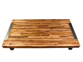 Custom edge grain coffee table using juvenile teak with a brushed stainless metal base. 